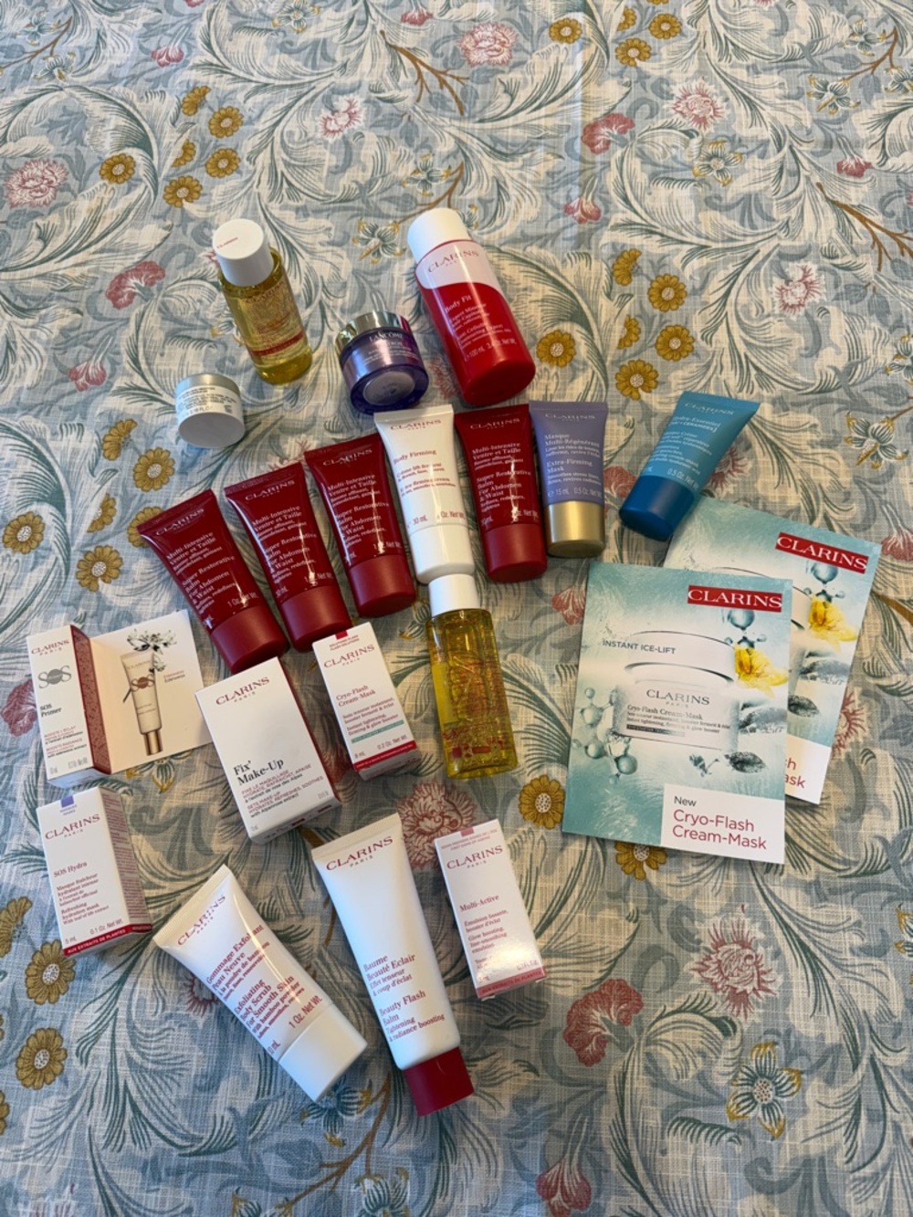 Clarins Skincare Assorted Capsules & Miniatures in Red, White, Gold